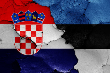 flags of Croatia and Estonia painted on cracked wall