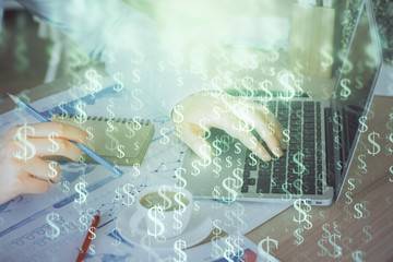Forex graph with businessman working on computer in office on background. Concept of hardworking....