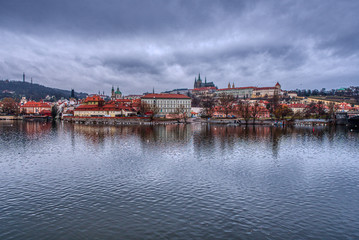 Fototapeta na wymiar historical part of Prague with castle and cathedral with vltava in foreground