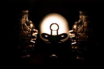 pacifiers, with black background, macro image