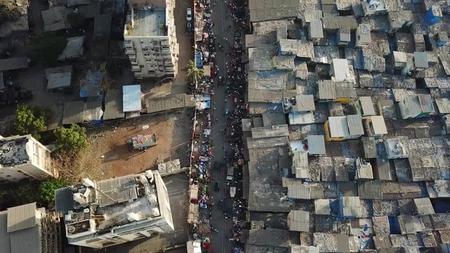 Street Market Between Dharavi Slum and Regular Residental Buildings in Mumbai. India. Birds Eye Top Aerial View