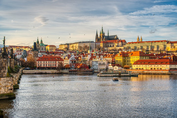 Fototapeta premium Beautifully lit Mala Strana with Charles Bridge at sunset, Prague