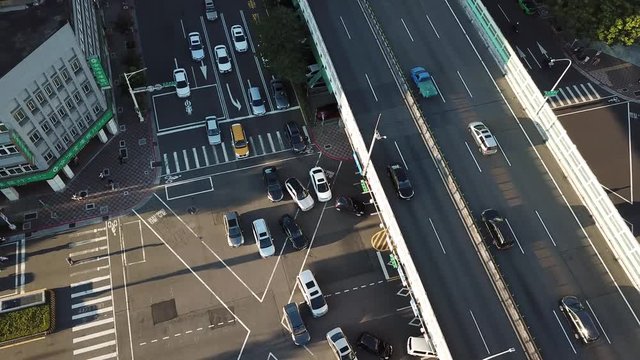 Busy Avenue Crossroad Traffic in Taipei Downtown on Golden Hour Sunlight, Birds Eye Top Down Aerial View
