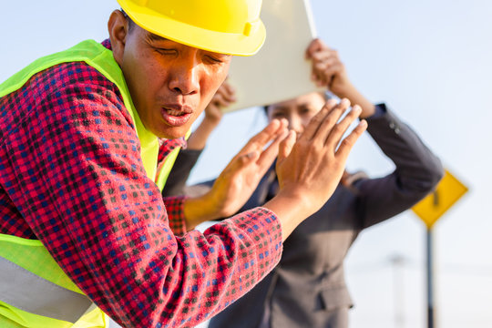 Foreman Afraid Manager At Site Construction..Businesswomen Angry Foreman And She Use Laptop For Hit.