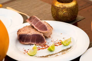 Delicious tuna steak with lime