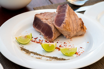 Delicious tuna steak with lime