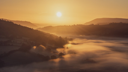 Autumn mist over Usk Valley at sunrise.