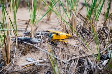 Yellow Airplane Toy on Beach