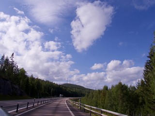 Fototapeta premium Country Road, cloudy sommar fourney in Sweden
