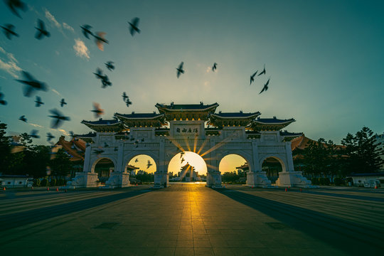 Chiang Kai Shek Memorial Hall with doves flying and the top building is written "Chiang Kai Shek Memorial Hall" in Chinese