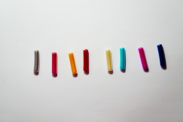 colorful markers on white background