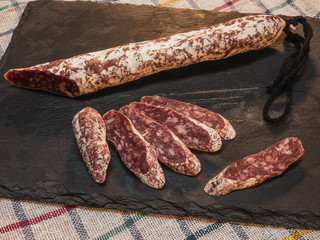 Close-up of Spanish extra sausage fuet made with Iberian pork meat