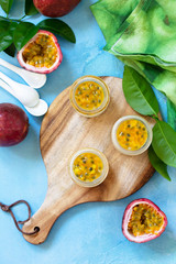 Passion fruit Panna cotta with passion fruit jelly, Italian dessert, homemade cuisine. Top view on a flat lay background.