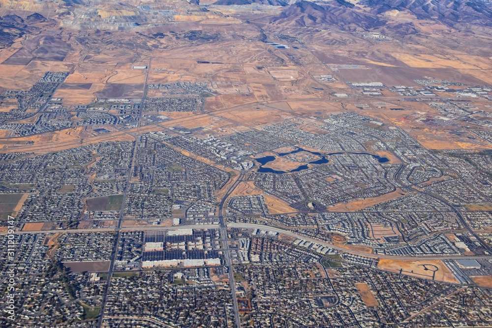 Wall mural daybreak lake and community and oquirrh mountains aerial, copper mine, wasatch front rocky mountains