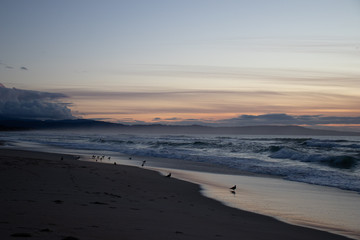 Fototapeta premium Sunset waves at Marina State Beach in Monterey County California 