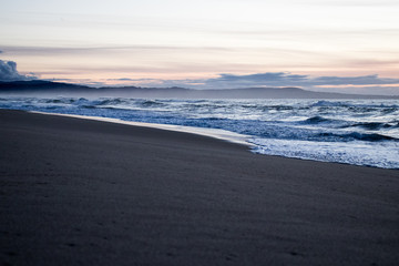 Sunset waves at Marina State Beach in Monterey County California 