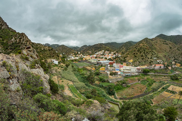 Fototapeta na wymiar Vallehermoso view point. Amazing panoramic view of one of the most beautiful valleys of the island. A small municipal center surrounded by agricultural plantations. La Gomera, Canary Islands