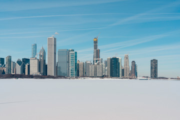 Chicago downtown skyline in winter scenery with snow covers Lake Michigan