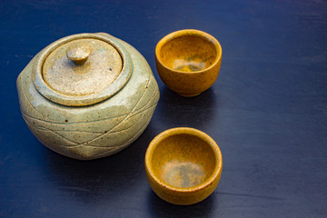 Vintage Ceramic Tea Setting on Black Background