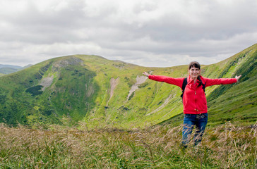 Naklejka premium beautiful girl on Goverla Mountain on a summer sunny day, Carpathians, Ukraine