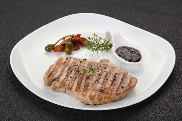 Grilled pork steak with pepper sauce