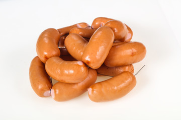 Tasty meat sausages over white background