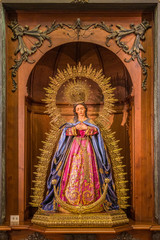 Wooden Virgin statue in the Parroquia de Santa María la Mayor (Saint Mary Major Parish) in Ronda. Malaga, Andalusia, Spain.