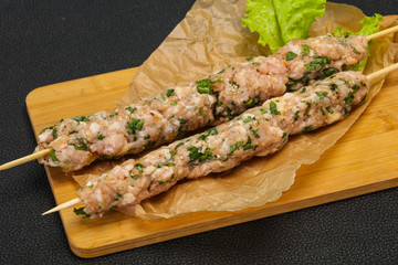 Raw minced pork skewer kebab for grill