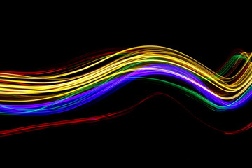 Long exposure photograph of neon multi colour in an abstract swirl, parallel lines pattern against a black background. Light painting photography.