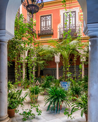 Colorful and elegant moorish cloister in Seville. Andalusia, Spain.