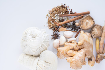 Spice herbs and compress ball on white background and copy space. Food and cuisine ingredients.Healthy herbal gourmet in the kitchen.