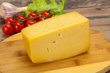 Hard yellow tasty cheese brick