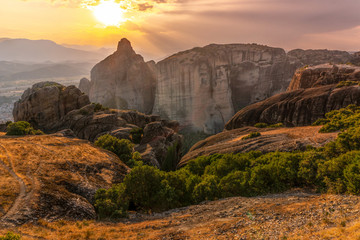 Sunny sunset and road to the mountains in Greece