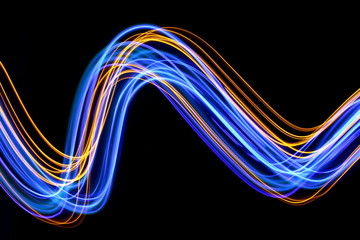 Long exposure photograph of neon blue and gold colour in an abstract swirl, parallel lines pattern...