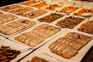 Meat slicing on a plate closeup