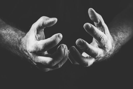 two desperate hands, in black and white