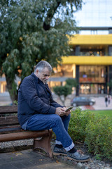 Fototapeta premium Senior man with a beard walking in the city