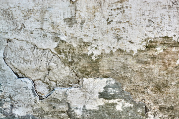 old whitewashed wall with cracks