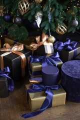 Christmas gifts in beautiful blue and golden boxes. Christmas gift boxes for celebration