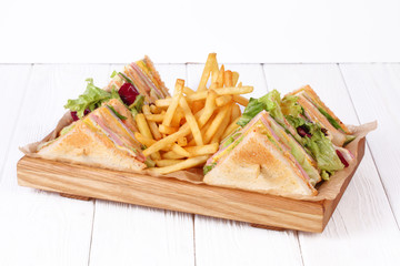 Tasty sandwich with fried chicken nuggets, tomatoes and lettuce