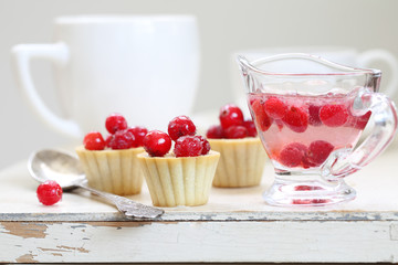 Fruit cupcakes with hazelnuts on a white background