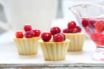 Fruit cupcakes with hazelnuts on a white background