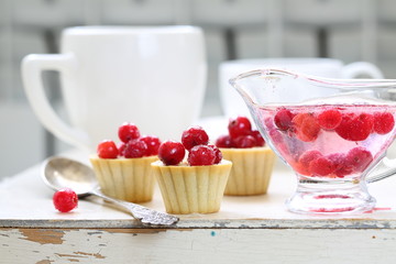 Fruit cupcakes with hazelnuts on a white background
