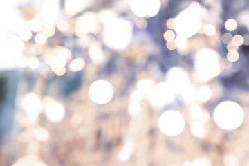 Abstract background blurred into golden and white bokeh