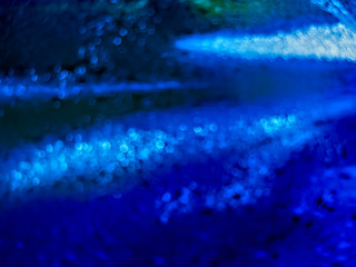 Fototapeta na wymiar Blue tone bokeh roundes abstract background