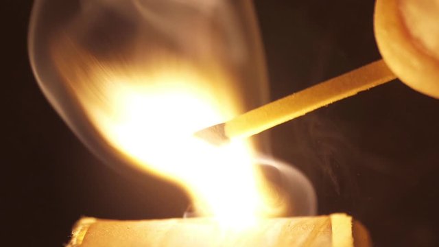 lighting a match macro shot slow motion