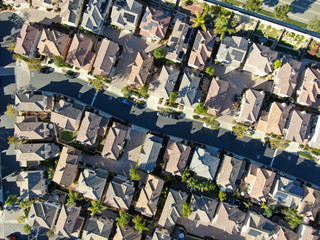 Aerial top view of upper middle class neighborhood with residential house next to each other in Chula Vista, California, USA.