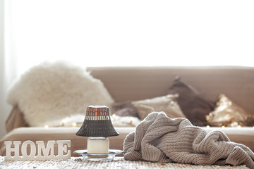 Still life in the living room with the inscription home.