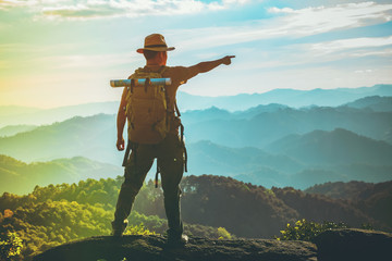 Men traveling with a backpack, hiking in the mountains, travel, travel, lifestyle, success, motivation, adventure concepts, outdoor vacations and sports.
