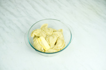 We cook the filling, knead the dough, sculpt the dumplings. Selective focus.